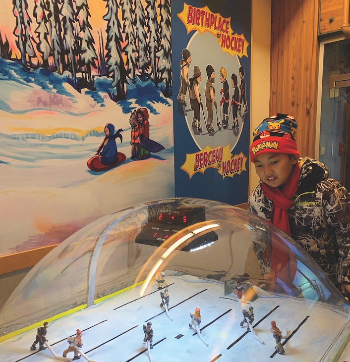Kobe Hsu learns hockey's alleged origin at the Prince of Wales museum in Yellowknife.