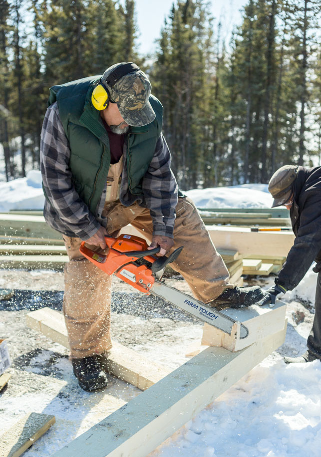 Donald Prince works on one of the structures at the temporary site for the Arctic Indigenous Health and Wellness Project. Photo by Stephanie Hansen/Up Here