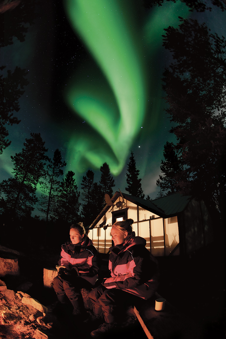 Northern lights hang over Northern Tales’ trading post, near Whitehorse