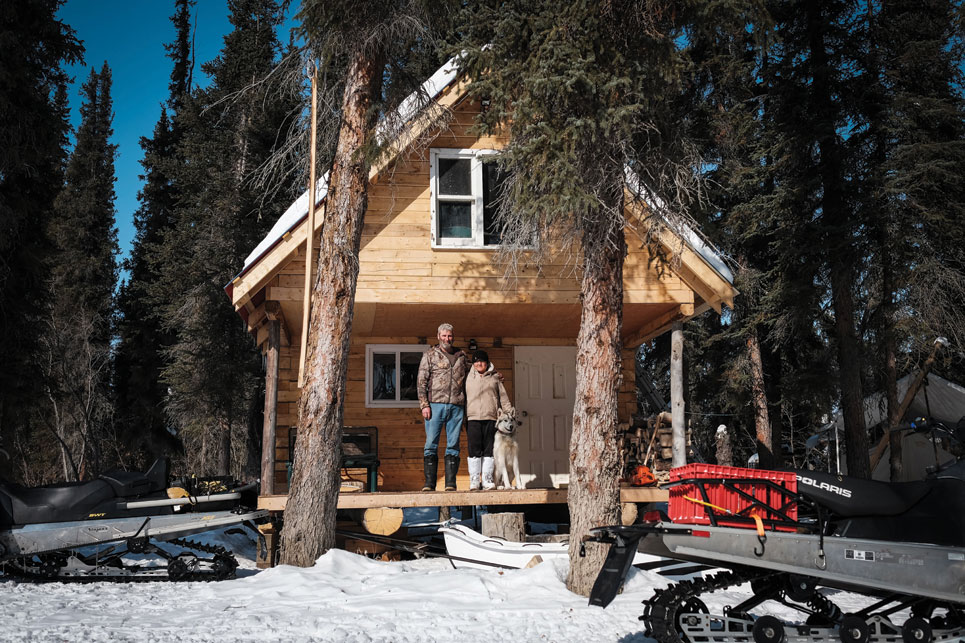Randy Zerke, Marsha Day and dog Dempster. With the prohibitive costs of travel, owning a cabin is the cheapest way to get a break from town, Day says. Photo by Weronika Murray