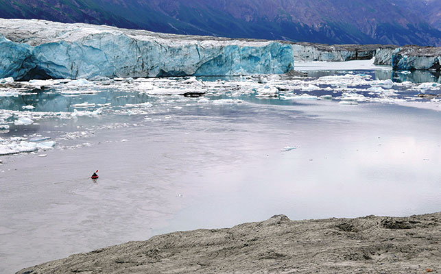 DWARFED BY THE DONJEK GLACIER IN KLUANE NATIONAL PARK. Photo courtesy of Paul Burbidge.