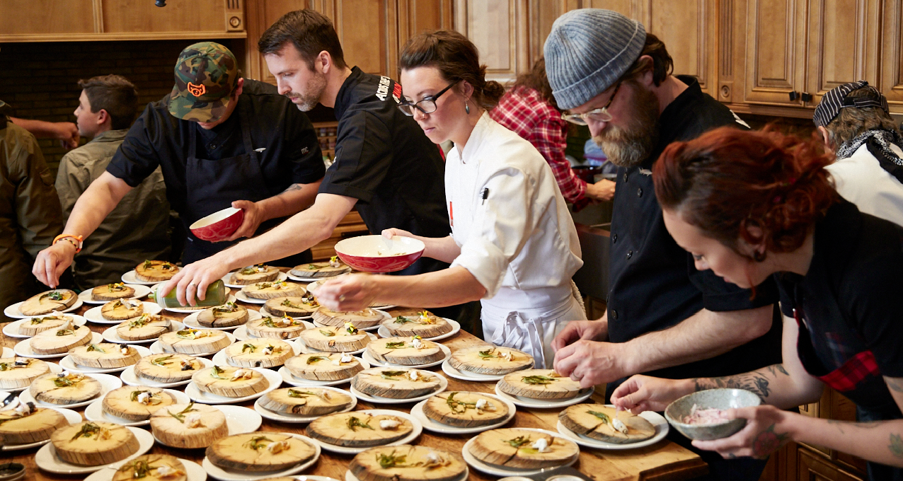 Chefs plate a meal at Yukon chef Carson Schiffkorn’s Inn on the Lake during the ‘Across the Top of Canada’ culinary tour last June. Courtesy Edible Canada