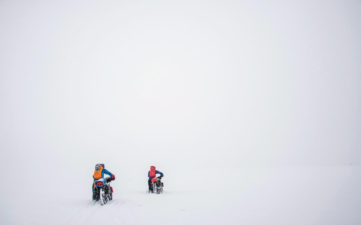 Karl Medig, Carl Moriarty, and Alex Frankel cycle through Auyuittuq National Park in Nunavut. 