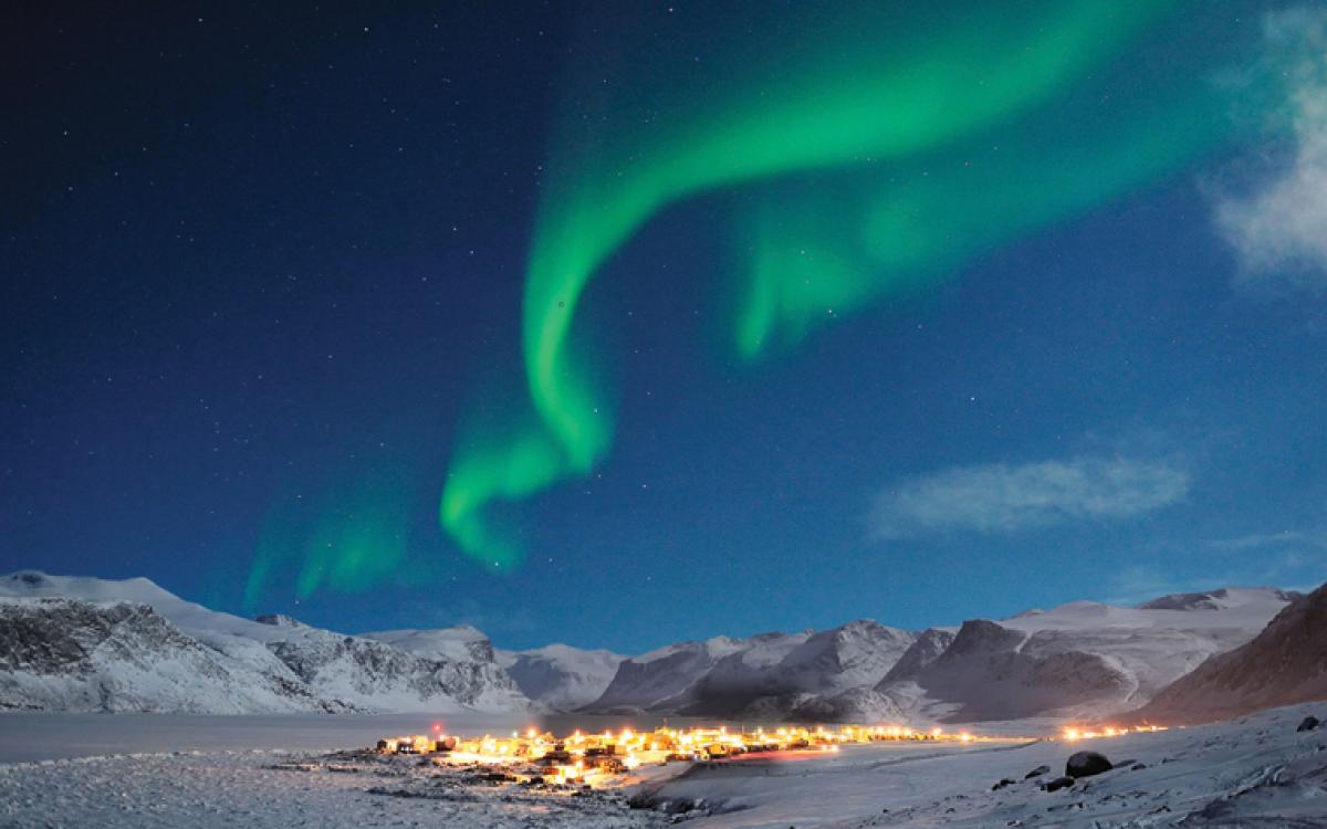 The aurora shimmer over Pangnirtung, Nunavut in winter. www.michaelhdavies.com