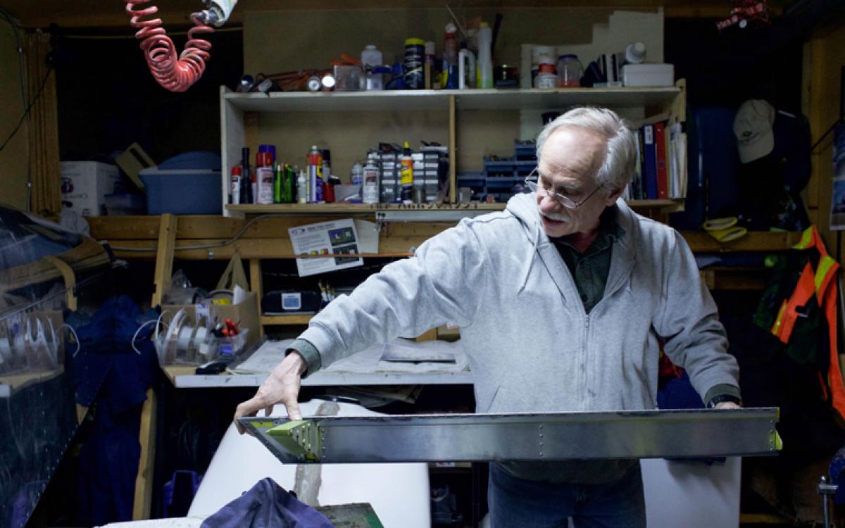 In his workspace, Holloway examines an aileron, a hinged piece that attaches to the wing. Once complete, the Sonex (that’s the name of the aircraft model) will measure 5.5 metres long and 6.7 metres wide. Photo by Hannah Eden/Up Here