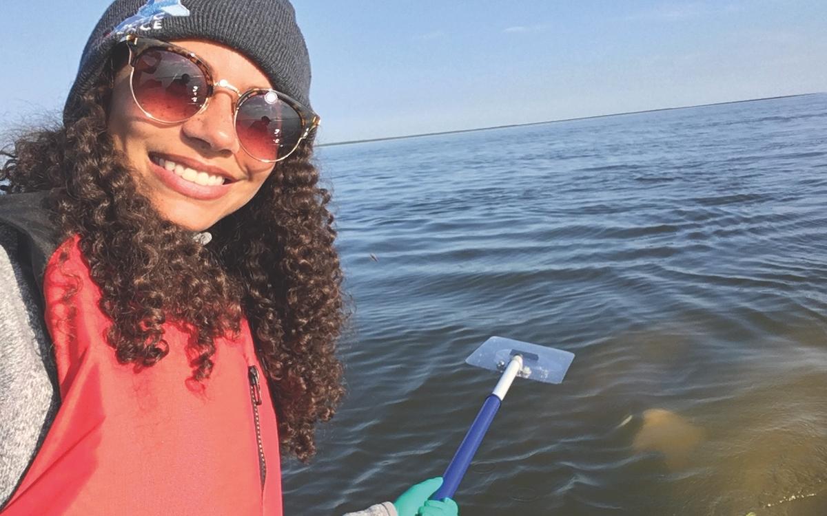 Justine Hudson waits for some whale snot samples.