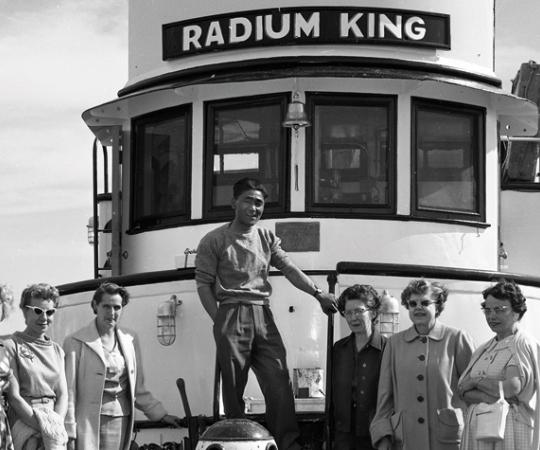 The captain of the Radium King with passengers in Yellowknife in 1954. Credit: NWT Archives, Henry Busse fonds, N-1979-052: 0611