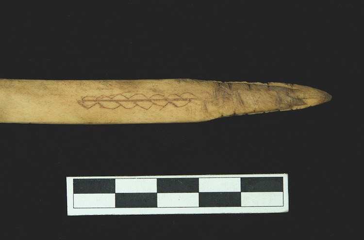 The spear tool features a carved design resembling a double helix. COURTESY CHAMPAGNE AND AISHIHIK FIRST NATIONS