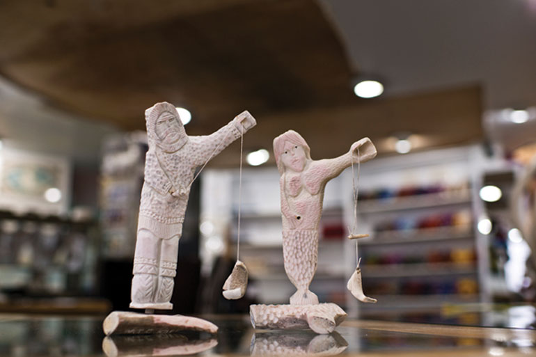 Two carvings on display at the Uqqurmiut Centre for Arts and Crafts. Photo by Angela Gzowski
